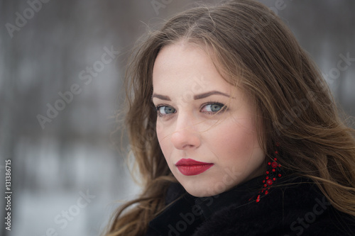 Winter portrait of a girl with long hair