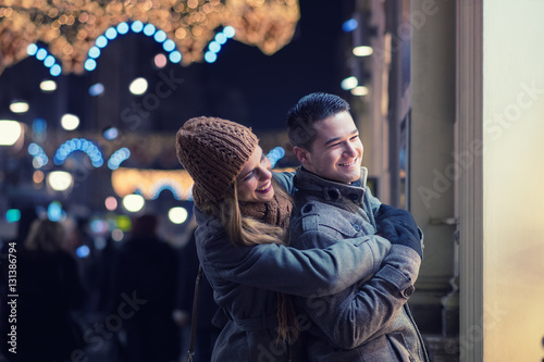 Photography Young lovers enjoy on the street at night in the city, the street lights, romance