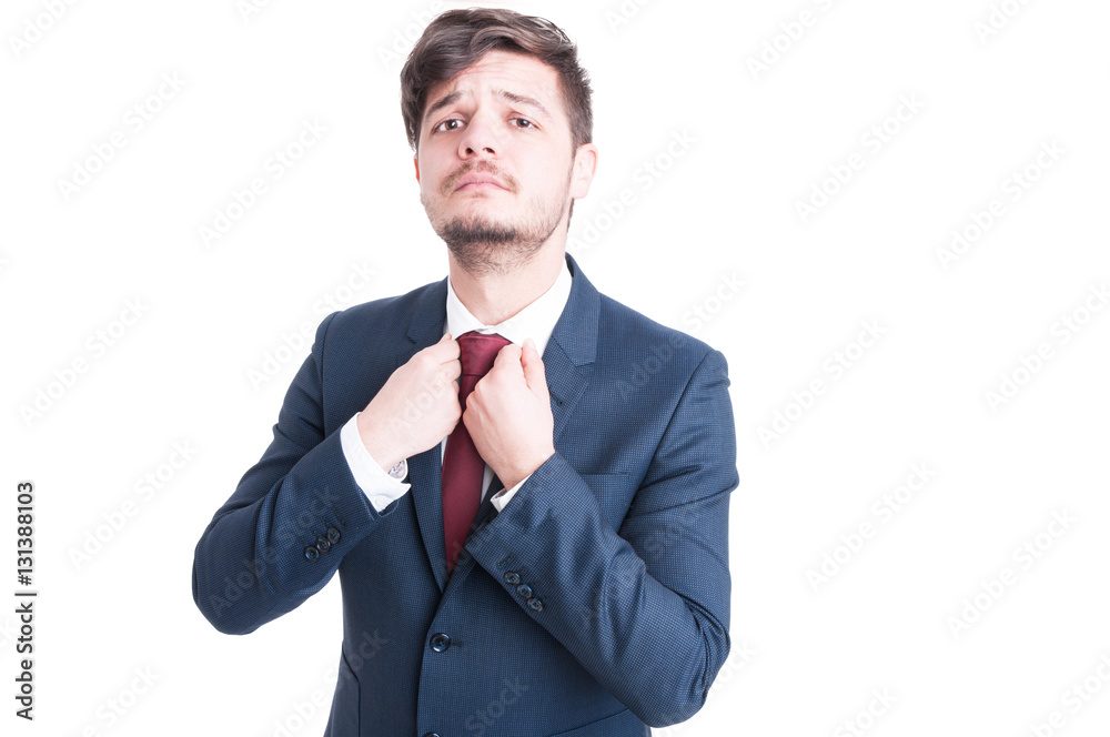 Marketing manager arranging shirt wearing elegant suit Marketing manager arranging shirt wearing elegant suit