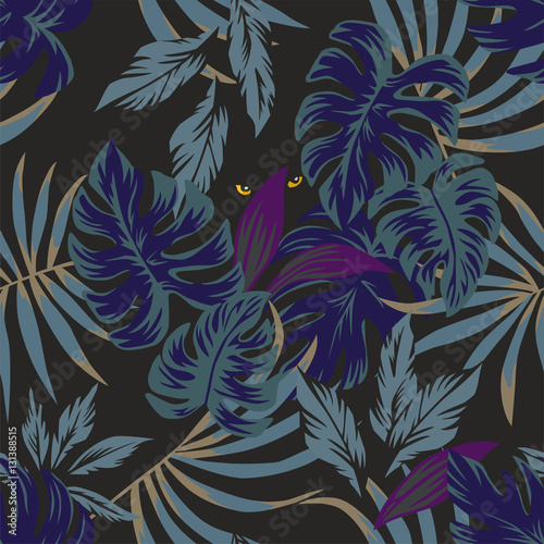 night tropical leaves pattern with eyes in the middle