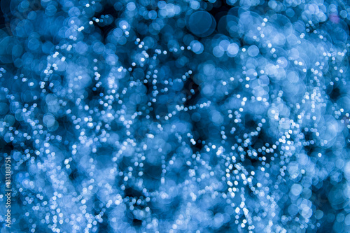 Abstract defocus bokeh background of holiday lights resembling a view of galaxies in space