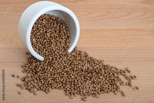 Organic Coriander Seeds in White bowl