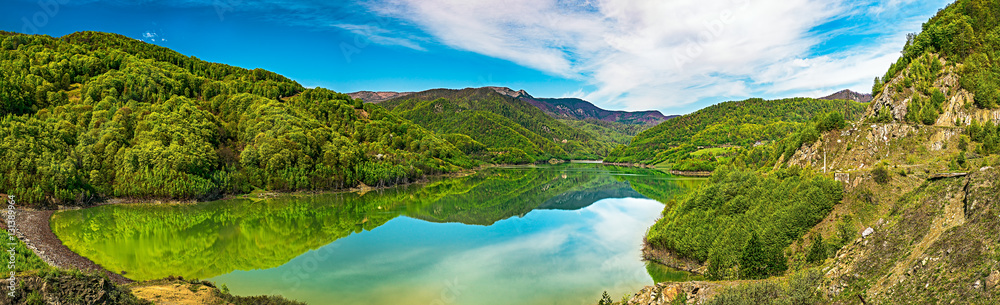 Panoramic spring view with clear mountains lake. Siriu lake, Buzau county, Romania Panoramic spring view with clear mountains lake. Siriu lake, Buzau county, Romania