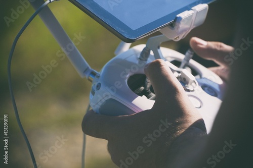 Drone remote control in hand man.Man operating of flying drone