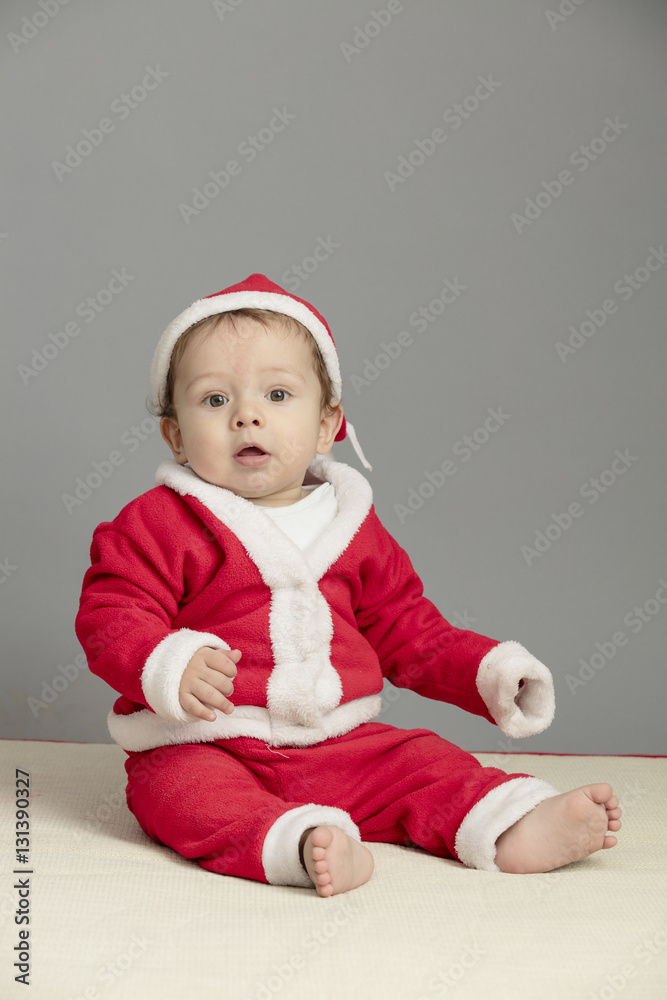 Caucasian baby in Santa Clothes isolated inside studio Caucasian baby in Santa Clothes isolated inside studio