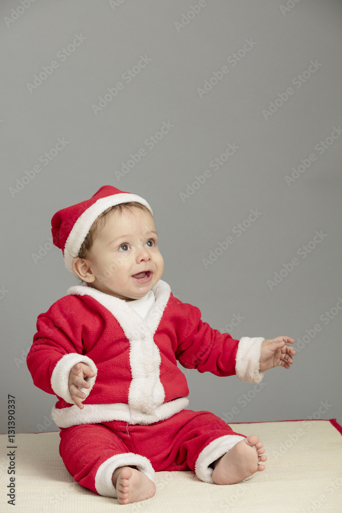 Caucasian baby in Santa Clothes isolated inside studio Caucasian baby in Santa Clothes isolated inside studio