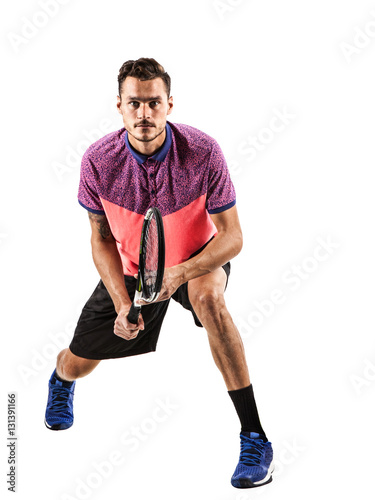 Fototapeta Naklejka Na Ścianę i Meble -  Male tennis player with racket ready to hit a tennis ball