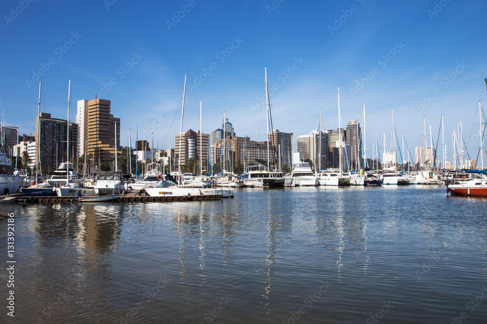 Obraz premium Vessels Moored at Yacht Mole Against City Skyline