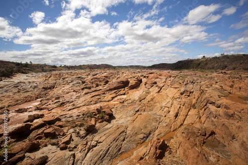 wide river bed Betsiboka, flushes red soil after heavy rains in Madagascar