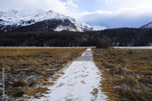 Engadin valley in Switzerland Sils Maria village with snow on Alp mountains