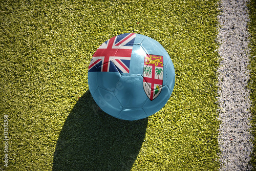 football ball with the national flag of Fiji lies on the field photo