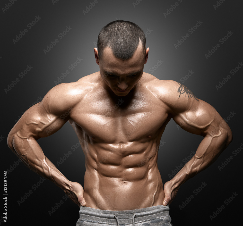 Strong Athletic Man Fitness Model Torso showing big muscles Strong Athletic Man Fitness Model Torso showing big muscles