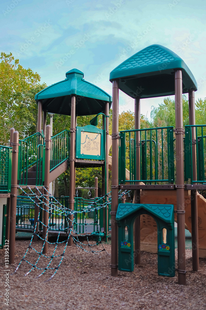 Happy Childhood kid playground fun for leisure and recreation activity with toy,stairs slides equipment leftover and climb.Nobody season ladder nature ground outdoor on yard in the park in color style Happy Childhood kid playground fun for leisure and recreation activity with toy,stairs slides equipment leftover and climb.Nobody season ladder nature ground outdoor on yard in the park in color style
