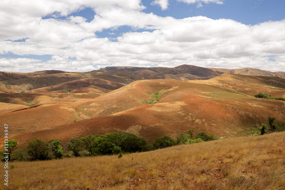 Beautiful sky over the wavy deforested landscape of northwest Madagascar