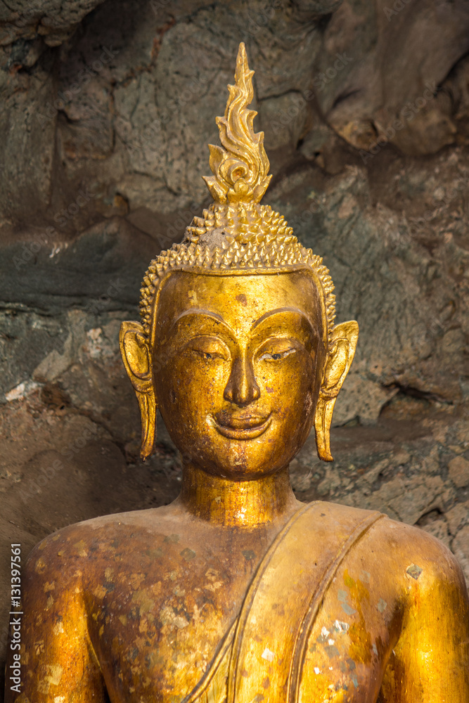Fototapeta premium Buddha in the cave , deep to the cave in Thailand