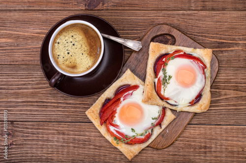 Red pepper and baked egg galettes and cup of coffee.