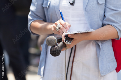Female reporter at press conference