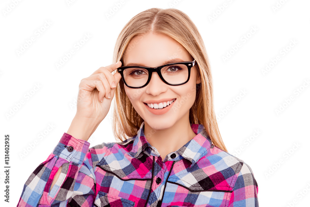 Portrait of pretty young happy woman touching glasses