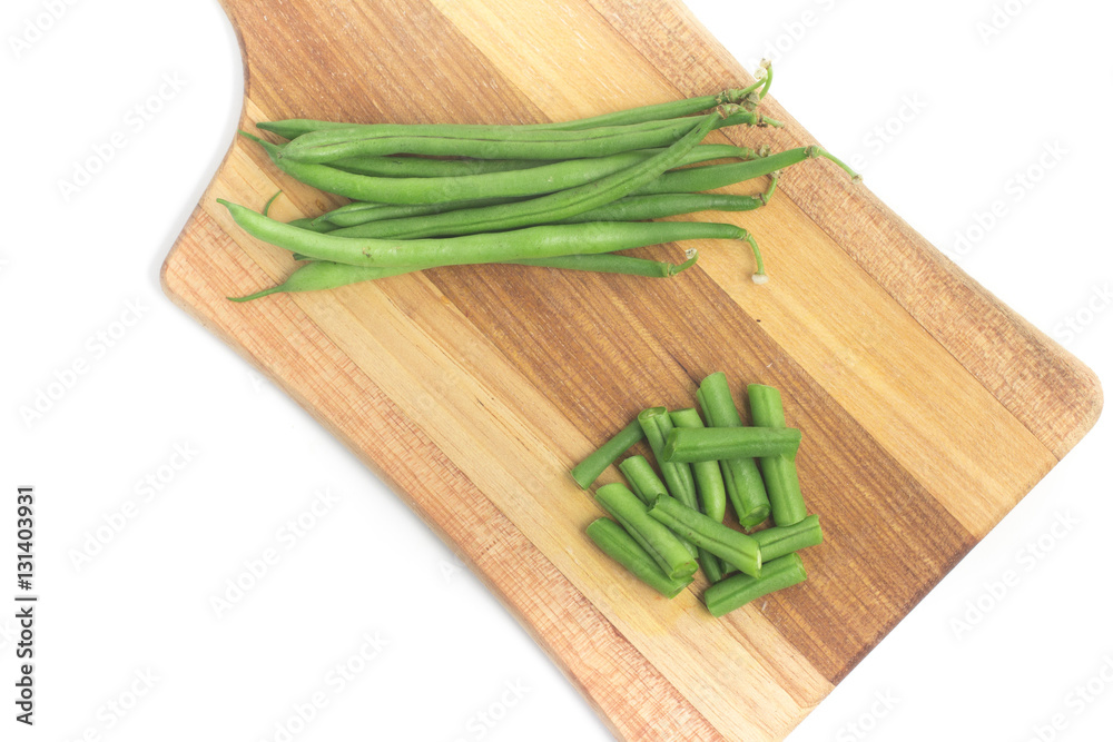 Green Beans Pods over a wooden board. Slim Green Beans Pods over a wooden board. Slim