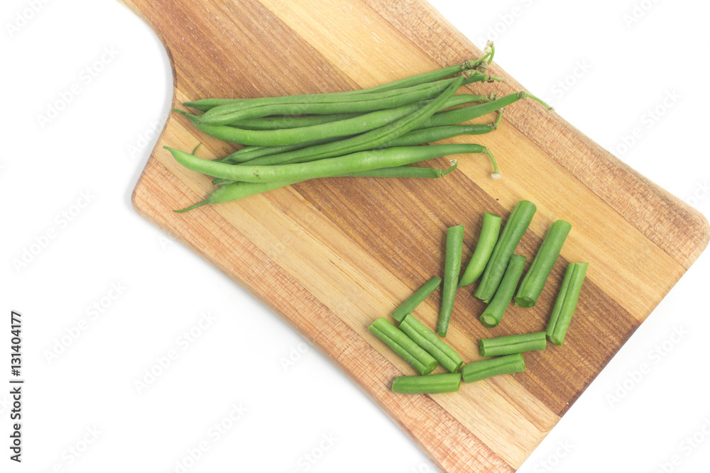 Green Beans Pods over a wooden board. Slim Green Beans Pods over a wooden board. Slim