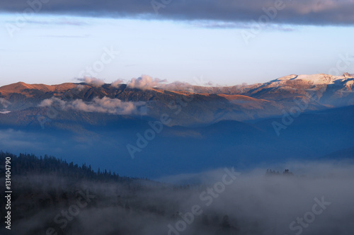 Fog in the mountains. View of the mountains in the distance. © Bahvalov-s