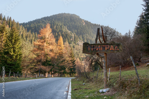 The sign of village of Trigrad - popular tourist destination in photo