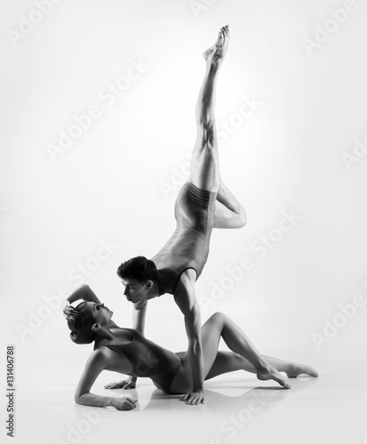 Young ballet dancers on a white background