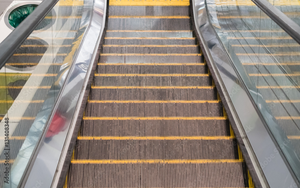 modern escalator in shopping center modern escalator in shopping center
