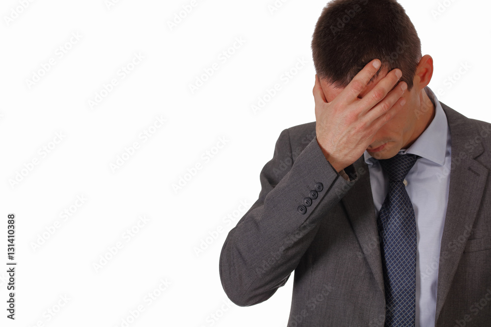 Stressed business man suffering from a headache isolated on white background