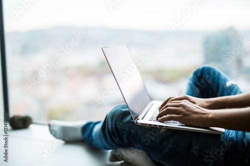 Close up handsome modern man designer working home using laptop at home