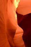 Slot Canyon - The sun shines in a red sandstone slot canyon. 