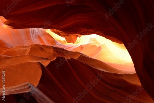 Burning Rock - Summer sun lights up the colorful sandstone rocks in a high desert slot canyon