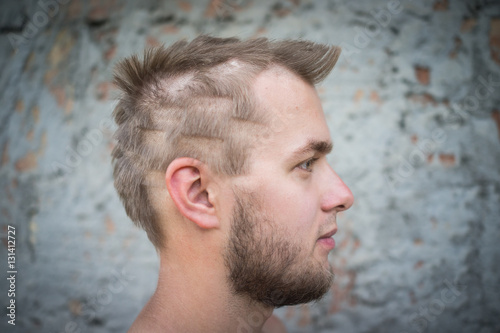 Young man closeup portrait with damaged hair