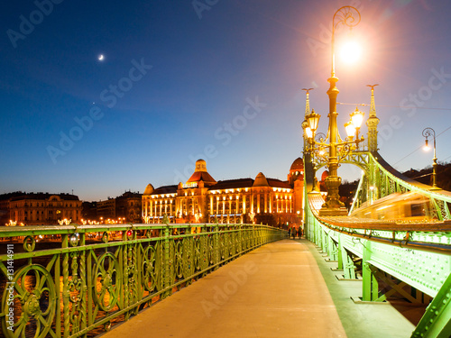 Night shot. of Art Nouveau style historical building of Gellert spa on the bank of Danube River in Budapest, capital city of Hungary, Europe. Evening view from Liberty Bridge.