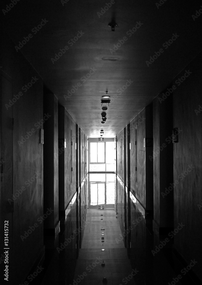 Black and white hotel hallway