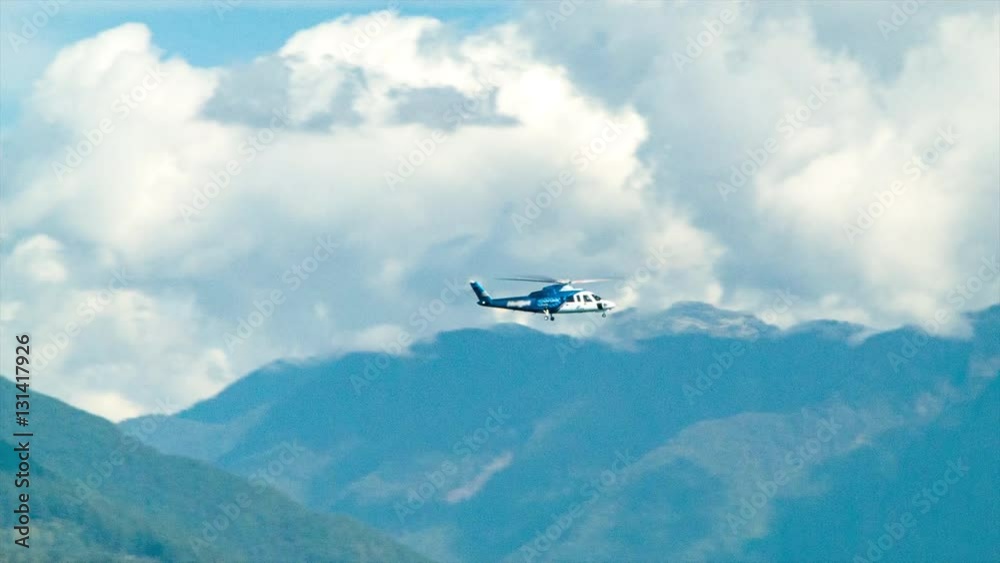 Generic Helicopter Flying Over Vancouver Harbour Canada on a Sunny Day in British Columbia Generic Helicopter Flying Over Vancouver Harbour Canada on a Sunny Day in British Columbia