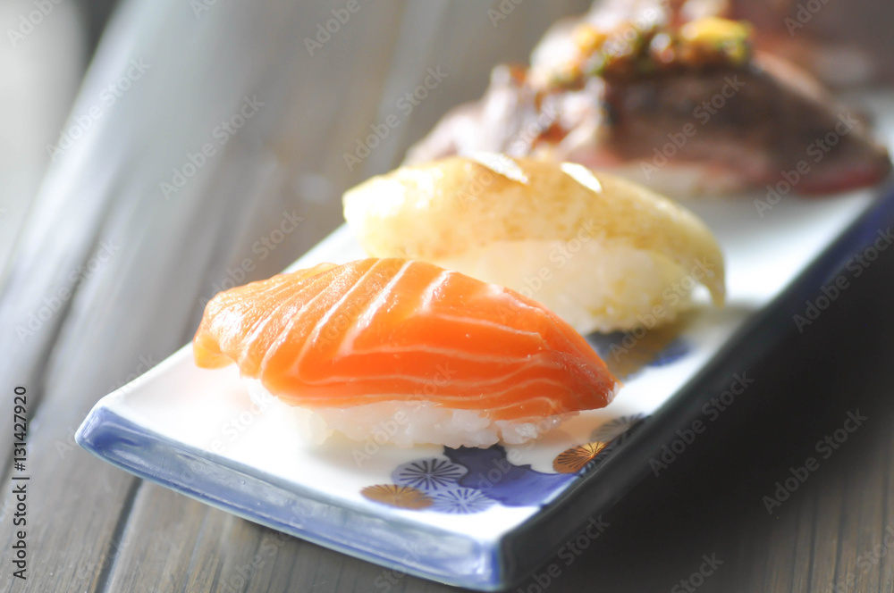 salmon sushi , rice topped with raw fish (Japanese food) salmon sushi , rice topped with raw fish (Japanese food)