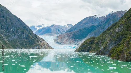 Sawyer Glacier Wide Shot in Tracy Arm Fjord Alaska with Floating Pieces of White Ice in the Water photo