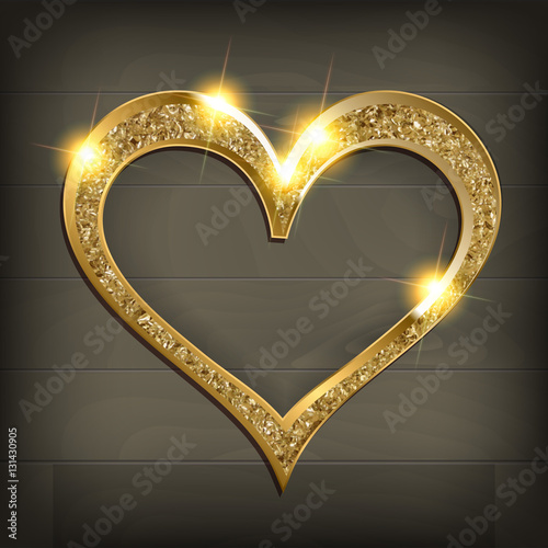 gold frame heart on wooden background