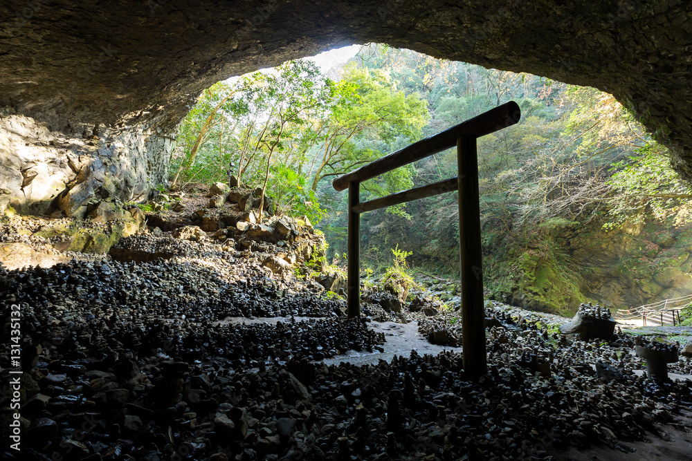 Shinto shrine torii in the cave Shinto shrine torii in the cave