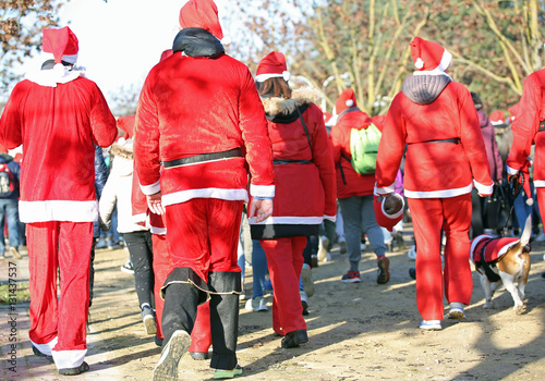 people run in the public park of the city at Christmas