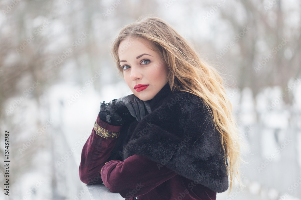 beautiful girl standing on the pedestrian bridge in winter beautiful girl standing on the pedestrian bridge in winter