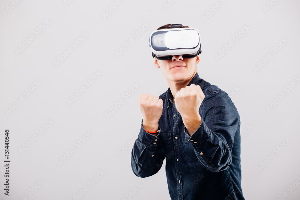 Man wearing virtual reality VR headset for box on white background Man wearing virtual reality VR headset for box on white background