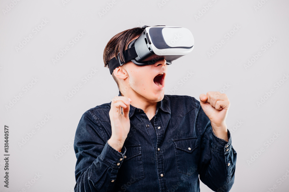 Scare man with virtual reality glasses isolated on white background Scare man with virtual reality glasses isolated on white background