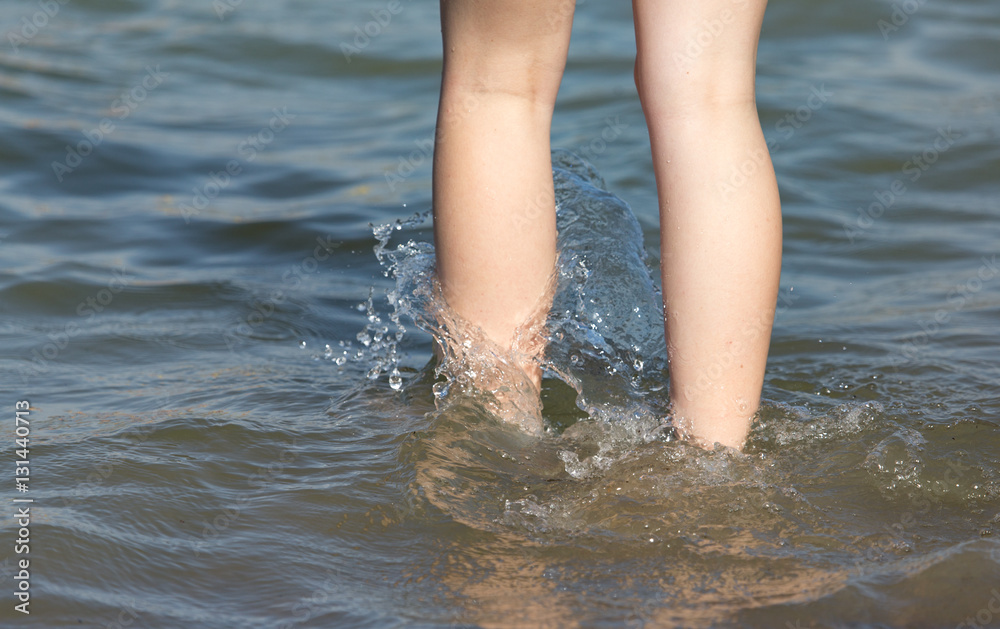 Girl legs in water