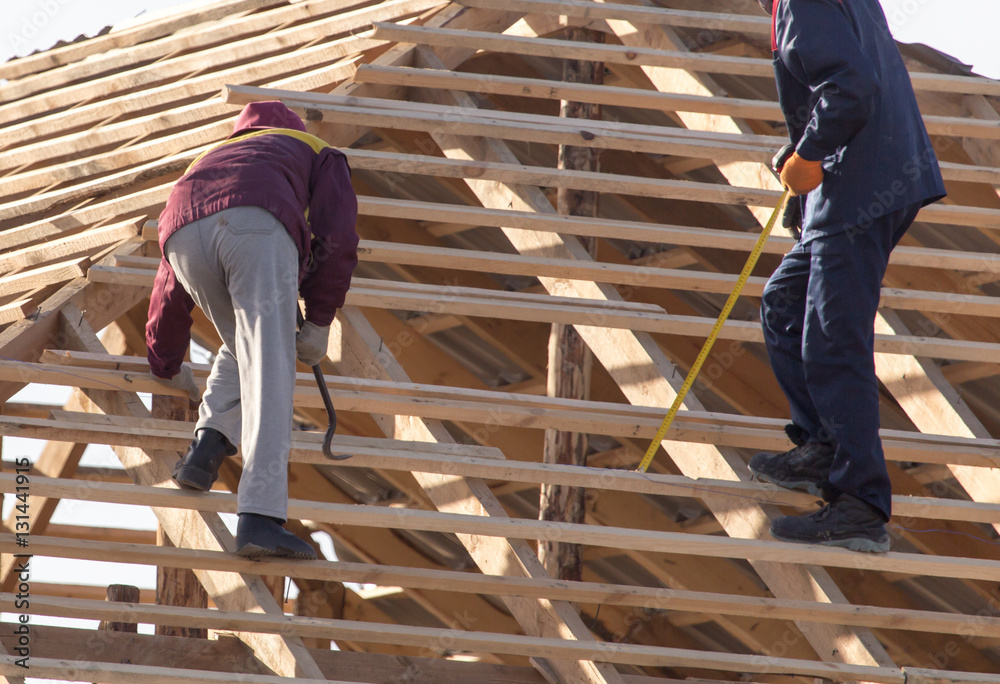 workers working on the roof