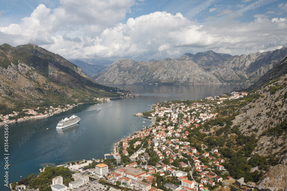 Beautiful Aerial view of the city, mountains and the ship in the Bay of Kotor