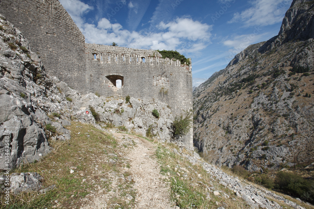 Ancient wall of the fortress of San Giovanni in the mountains. Montenegro