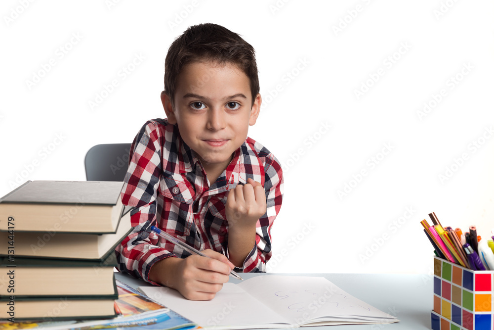 Satisfied schoolboy doing his homework Satisfied schoolboy doing his homework