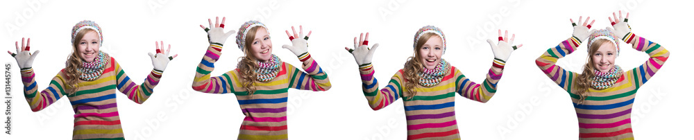 Cute cheerful teenage girl wearing colorful striped sweater, scarf, gloves and hat isolated on white background. Winter clothes. Composite image. Cute cheerful teenage girl wearing colorful striped sweater, scarf, gloves and hat isolated on white background. Winter clothes. Composite image.